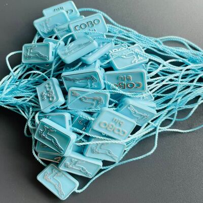 カジュアル エコフレンドリー プラスチックのタグ 固定器 衣類タグの完璧な選択 耐久的で安全な固定器